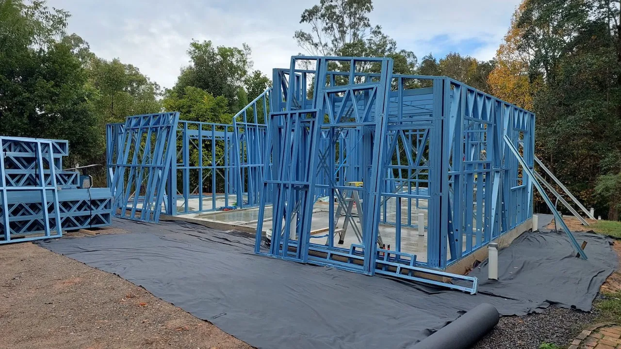 Site preparation for a kit home in Queensland — slab pour or steel floor system installation