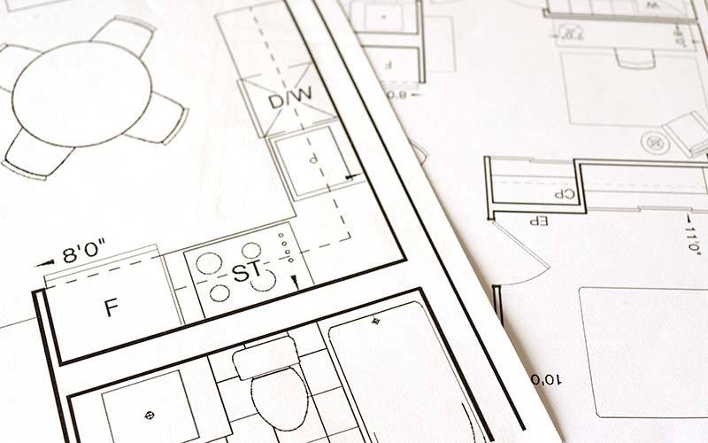 Wheelchair Accessibility House plans on a table